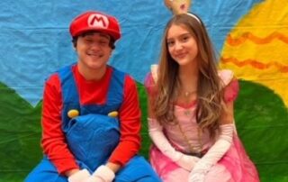 Students dressed as Mario and Peaches from Mario Kart game